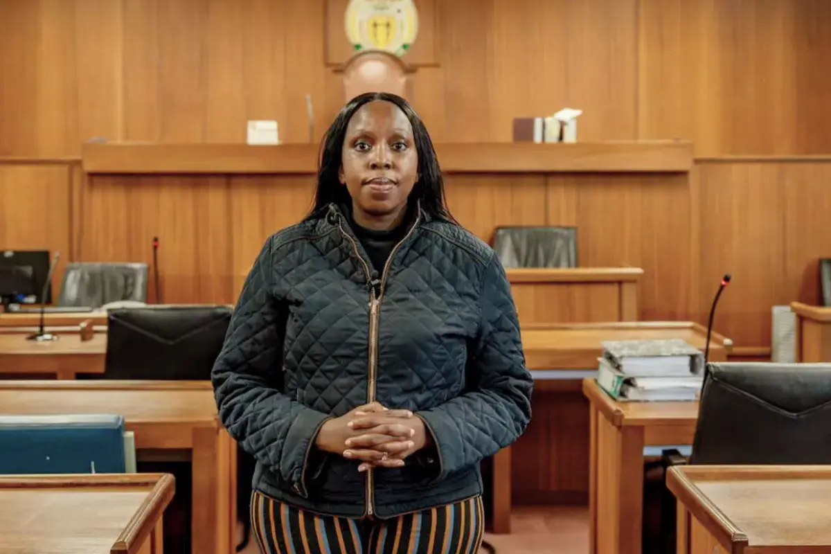 Kgomotso Modise stands in a courtroom